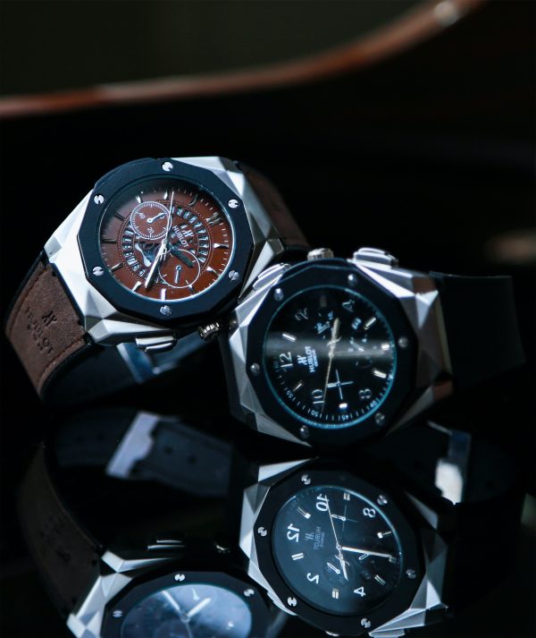 Chronograph Fusion Ceramic watch by Hublot with a geometric dial, large features, and black or brown color choices.