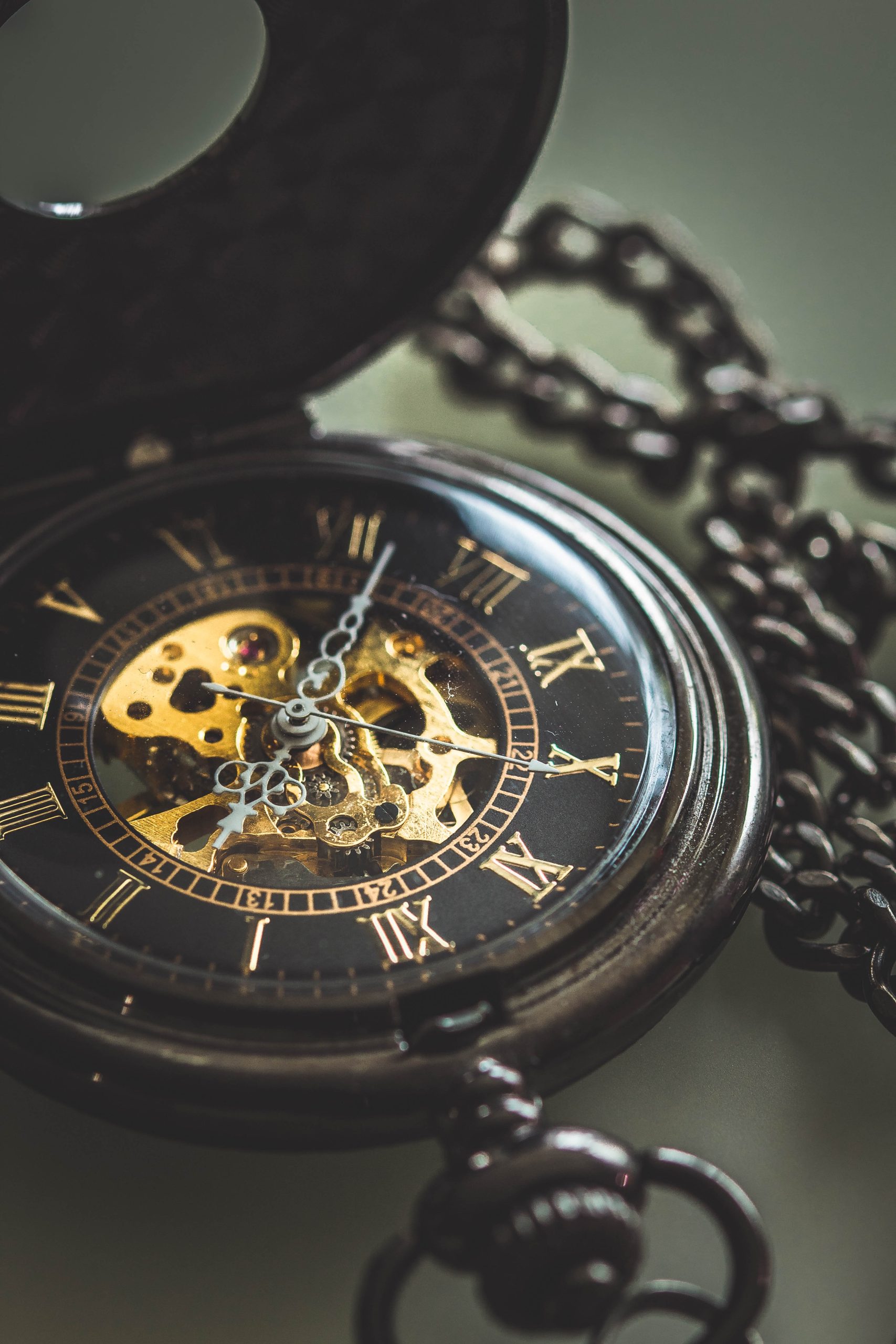 Silver pocket watch with a long silver chain