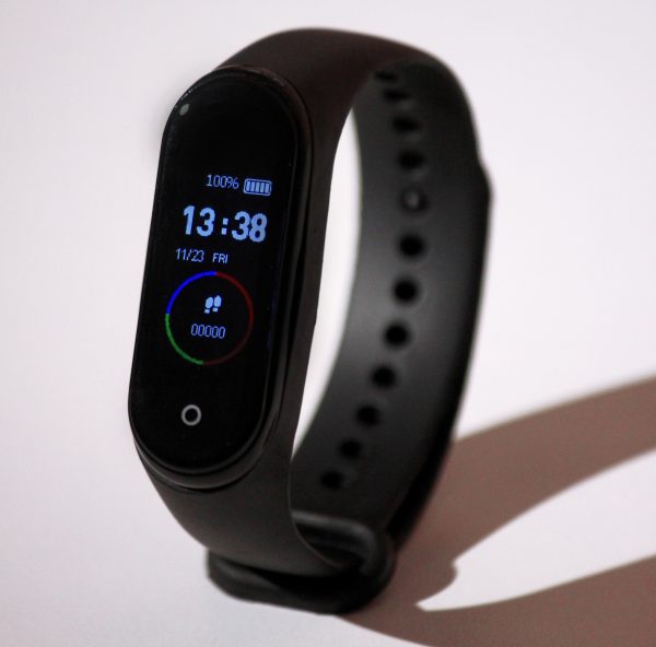 sleek black smart watch with a thin black strap.