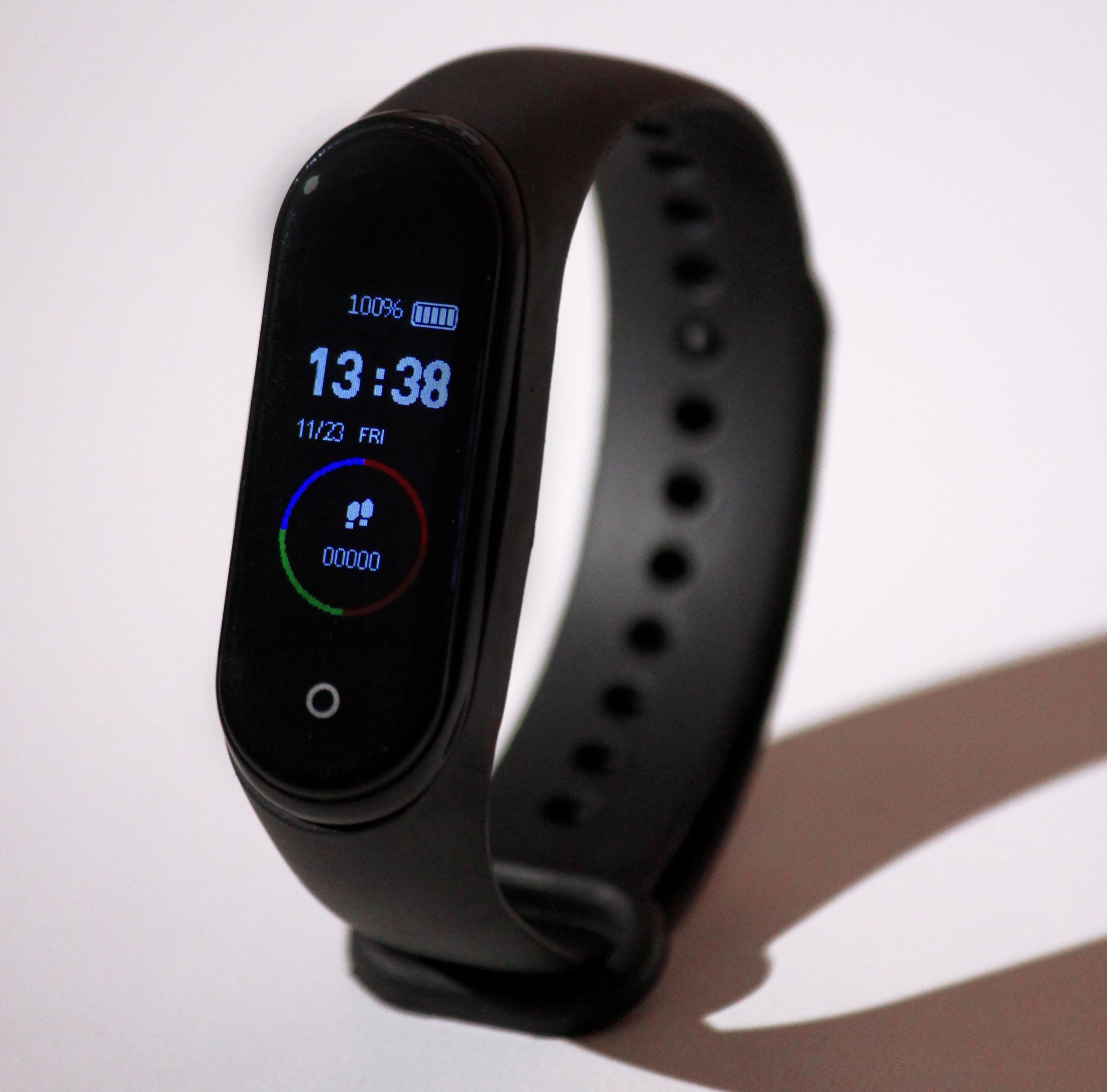 sleek black smart watch with a thin black strap.
