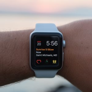 Wrist wearing a Heart tracker Smart watch by Ignite with a white band.
