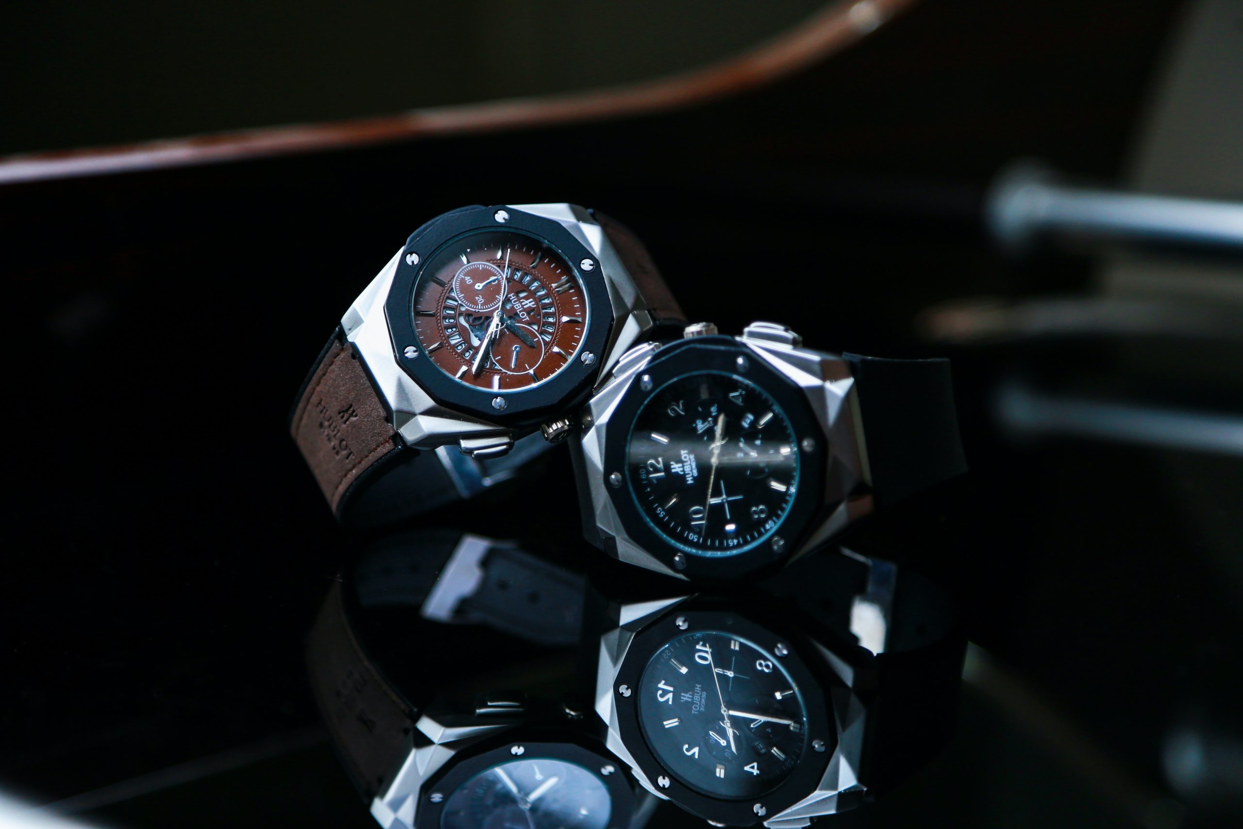 Black and brown watches by Hublot with geometric designs, with ceramic faces.
