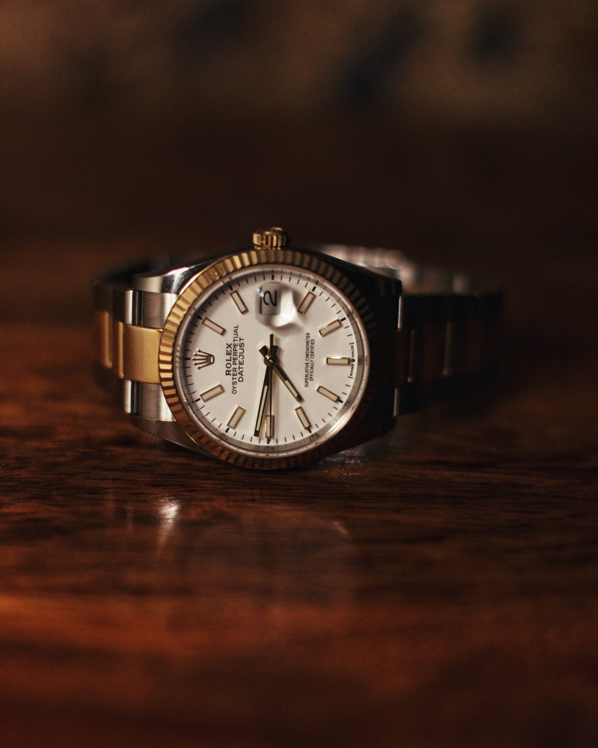 A silver and gold banded Rolex Oyster Perpetual Datejust watch.